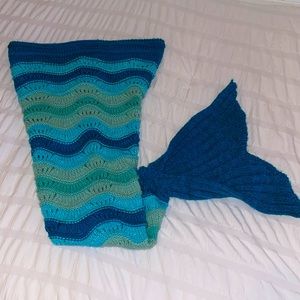 Knitted mermaid slide in blanket